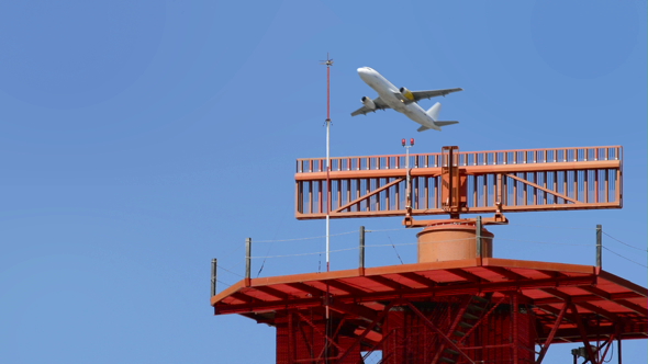 Airplane Taking Off over Tower with Radar