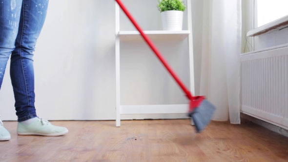 Woman With Broom Cleaning Floor At Home 87