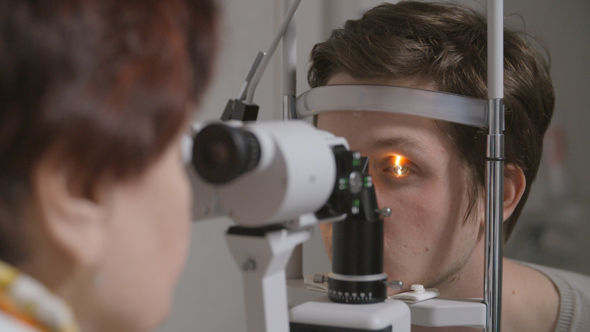 Woman Checking Vision Using Special Machine