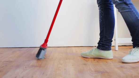 Woman With Broom Cleaning Floor At Home 88