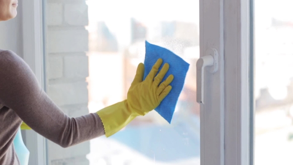 Woman In Gloves Cleaning Window With Rag 12