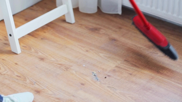 Woman With Broom Cleaning Floor At Home 30