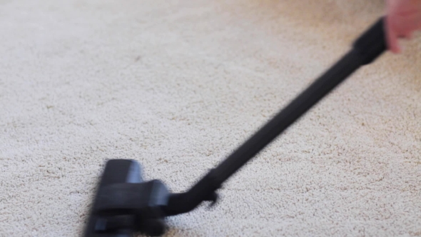 Woman With Vacuum Cleaner Cleaning Carpet At Home 43