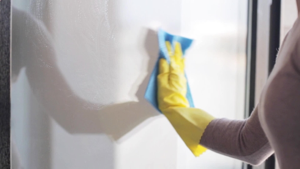 Woman In Gloves Cleaning Window With Rag 8