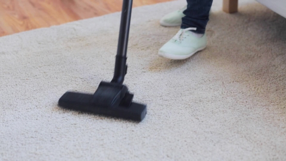 Woman With Vacuum Cleaner Cleaning Carpet At Home 45