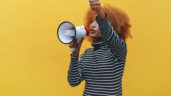 African American Black Woman with Curly Hair Shouting Into the Megaphone