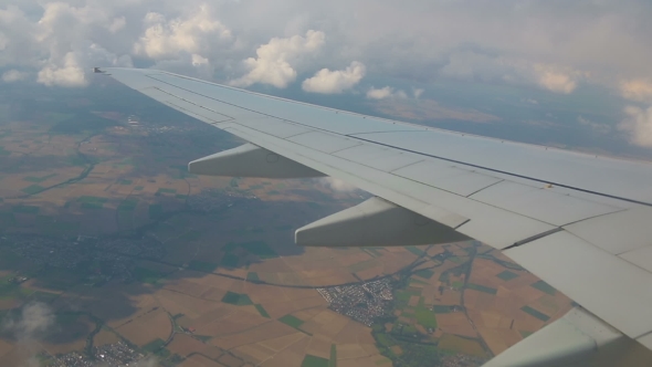 Aerial View From The Airplane On Cumulus Clouds alt