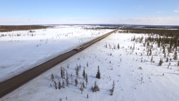 Aerial View Of Truck Moving On Winter Road