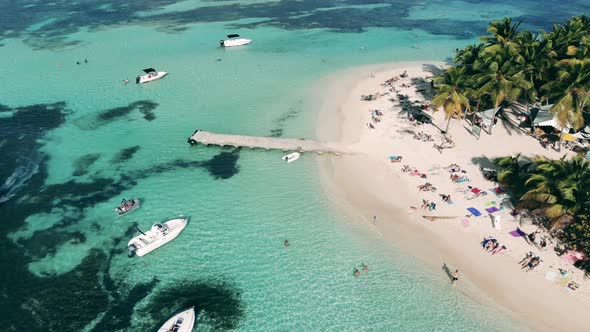 People Rest on a Beach on a Small Island.