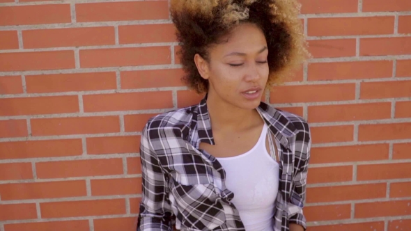 Portrait Of Black Woman At The Brick Wall