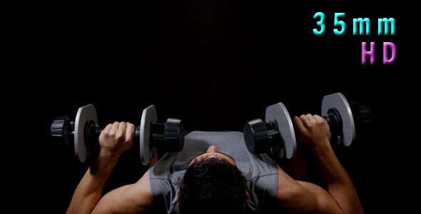 Young Man Exercising With Dumbbells 21