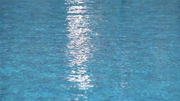 Light Reflected on the Blue Water Surface