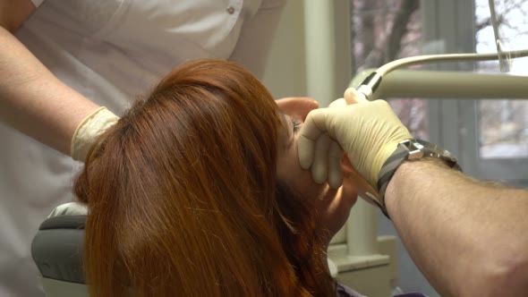 Young Woman in a Chair Dentist Dentistry