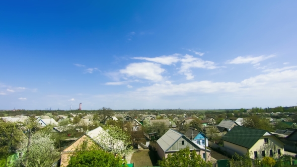 Clouds in the Sky Moving Over the Houses in the City alt