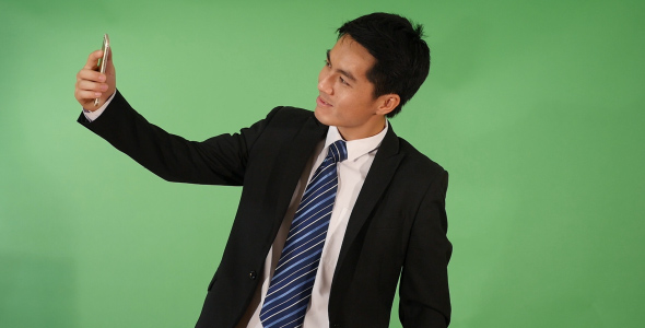 Asian Businessman Taking a Selfie