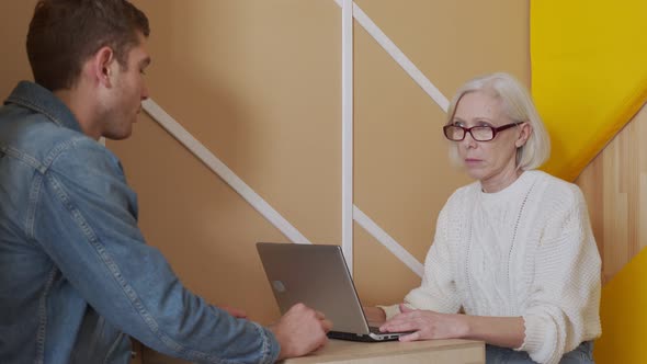 Elderly Female Boss Communicate with Subordinate. Recruiting New Candidate at Job Interview