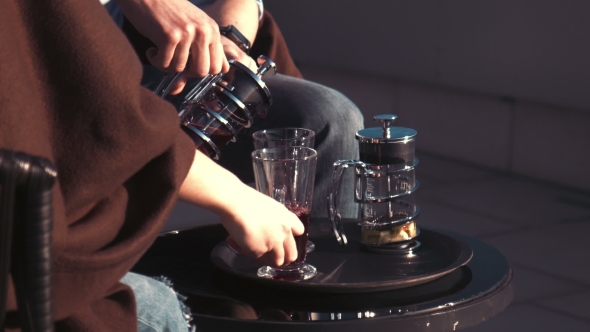 Couple Have Tea On Balcony Of Hotel 