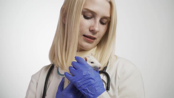 Veterinarian and Pet Rat on White Background