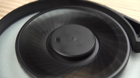 Plastic black computer laptop cooler rotates close-up