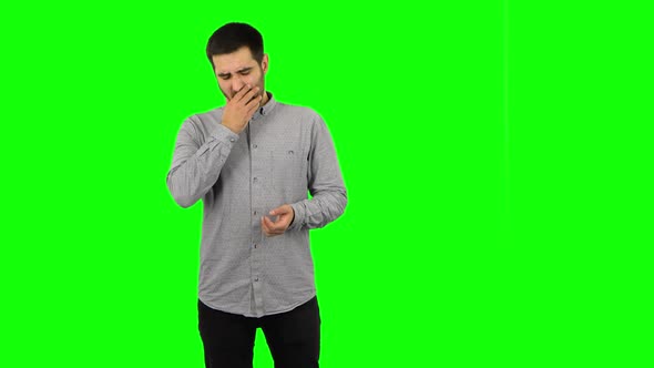 Brunette Guy Is Clapping His Hands Indifferent. Green Screen