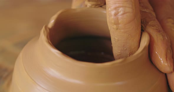 Hands Forming Clay