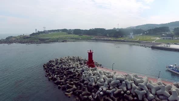 Aerial View Of Lighthouse On The Breakwater At Coastal In Southen Korea