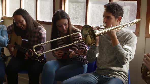 Teenage musicians rehearsing