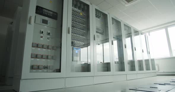 Big Modern Transformers with Glass Doors at the Factory Control Room