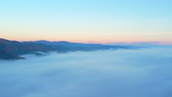 4K Sun is rising above sea of clouds until the horizon