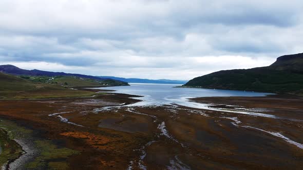 Drone shot of scottish dried up lake with mountain view. Aerial video shot in Scotland, highland lan