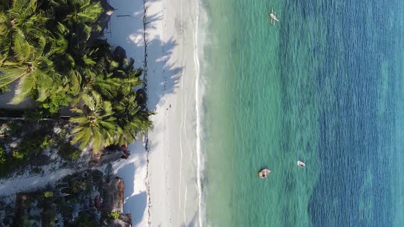 Vertical Video Boats in the Ocean Near the Coast of Zanzibar Tanzania Aerial View