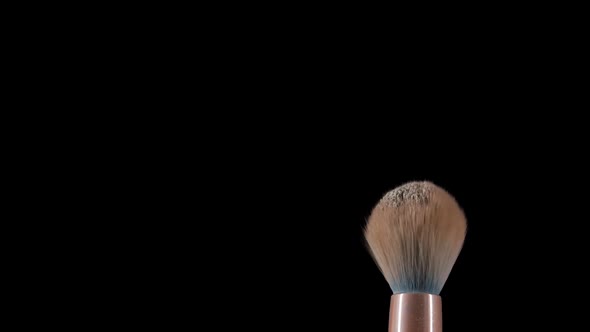 Flow of Air Blows Fine Powder Particles Off Makeup Brush