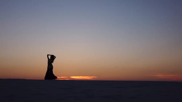 Graceful Movements of a Dancer, Dancing Belly Dance While on the Beach. Silhouettes