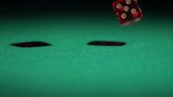 Slow-Motion Video of Gambling Game, Red Dice Falling on Green Casino Table