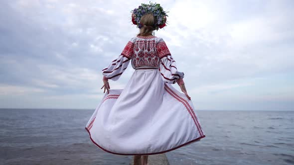 Live Camera Follows Slim Barefoot Ukrainian Woman in National Dress Walking in Slow Motion on River