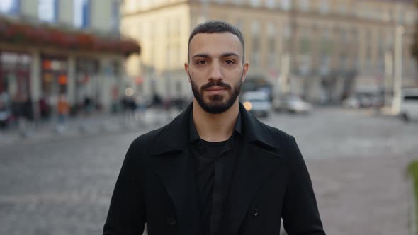 Portrait of Arabian Man in Stylish Wear Posing on Street