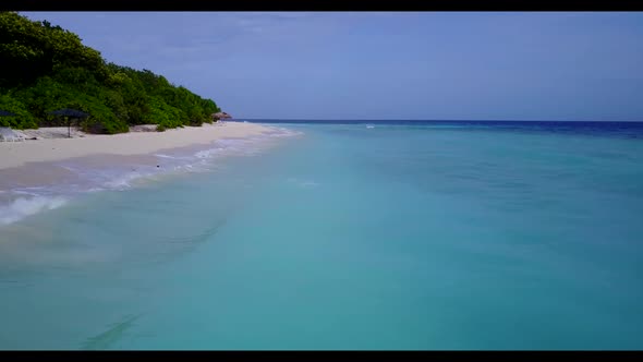 Aerial drone seascape of paradise island beach trip by blue green ocean with white sandy background 