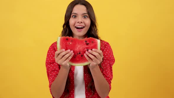 Amazed Kid Showing Slice of Watermelon Fruit on Yellow Background Selective Focus Yummy