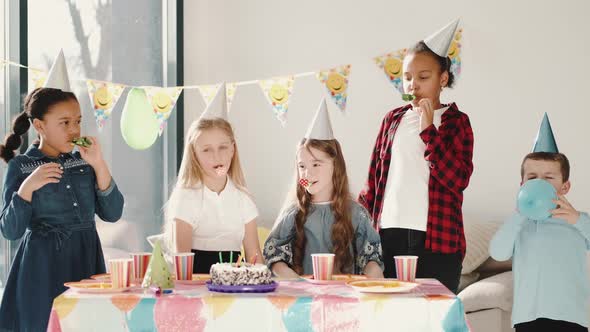 Group of Children Celebrating Birthday Party at Decorated Home