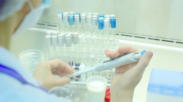 Scientific Research. Chemist Working At Modern Science Lab. Test Tubes alt