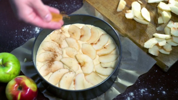 Spreading Cinnamon Powder On Apple Pie