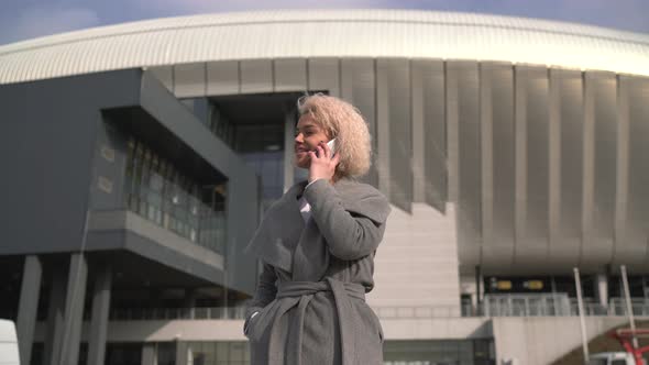 Woman answering her mobile phone