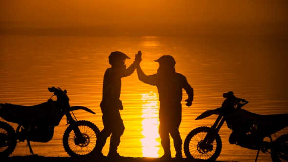 Two Motorcyclists Met At Beoregu River At Sunset