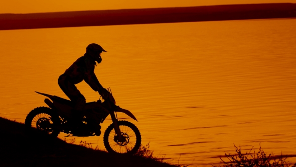 Motorcyclist Silhouette at Sunset