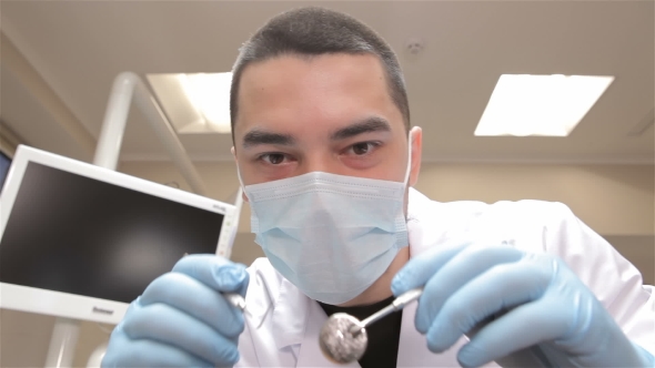 Dentist Examines Patient