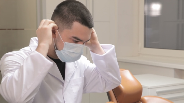 Dentist Wears The Medical Mask