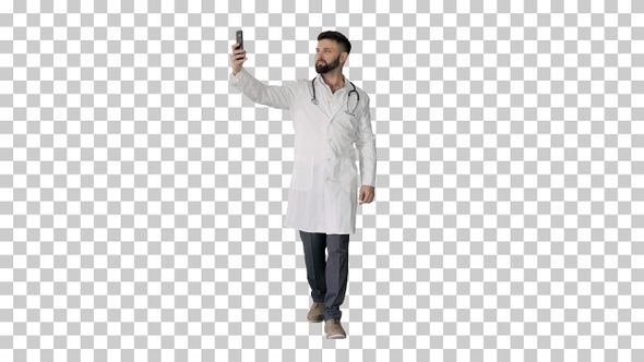 Doctor taking a selfie with smartphone while walking, Alpha Channel