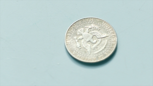 50 Cents Coin Spinning On The Edge