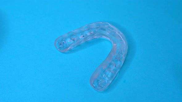 Doctor Grabbing a Dental Retainer or Dental Splint