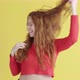Funny cheerful female sexually shakes her hair and laughs in good mood - VideoHive Item for Sale